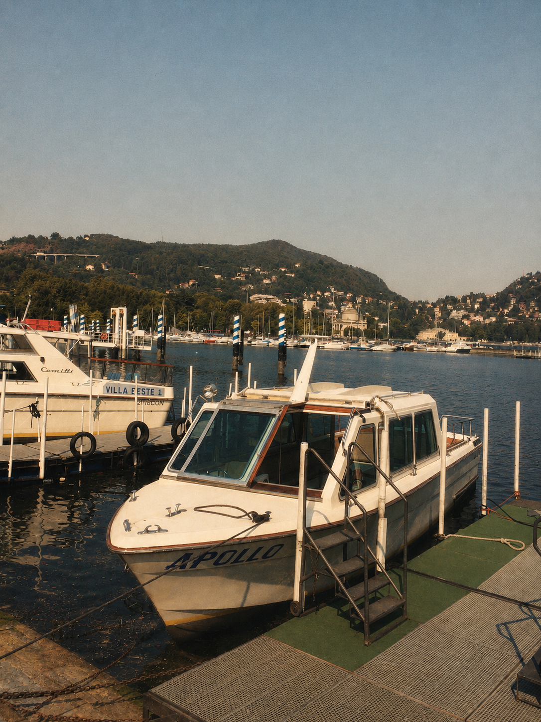The Apollo passenger boat tied at a working dock on the lake